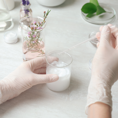 High angle view of a person reviewing cosmetic product labels